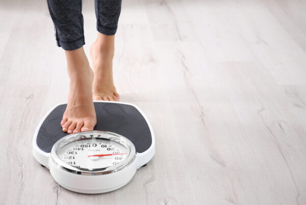 Standing on the weight scale.